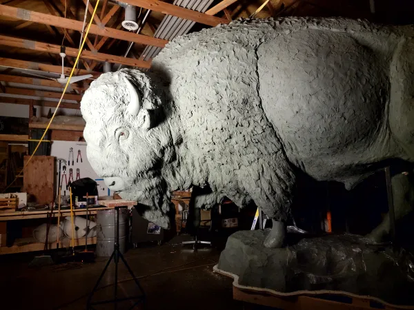 A larger than life sculpture of a bull bison